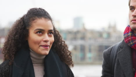 young tourist couple visiting london in winter