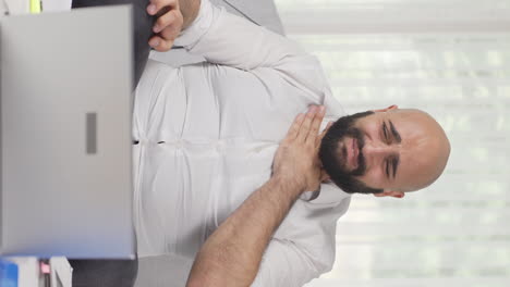 vertical video of home office worker man is sick and coughing.