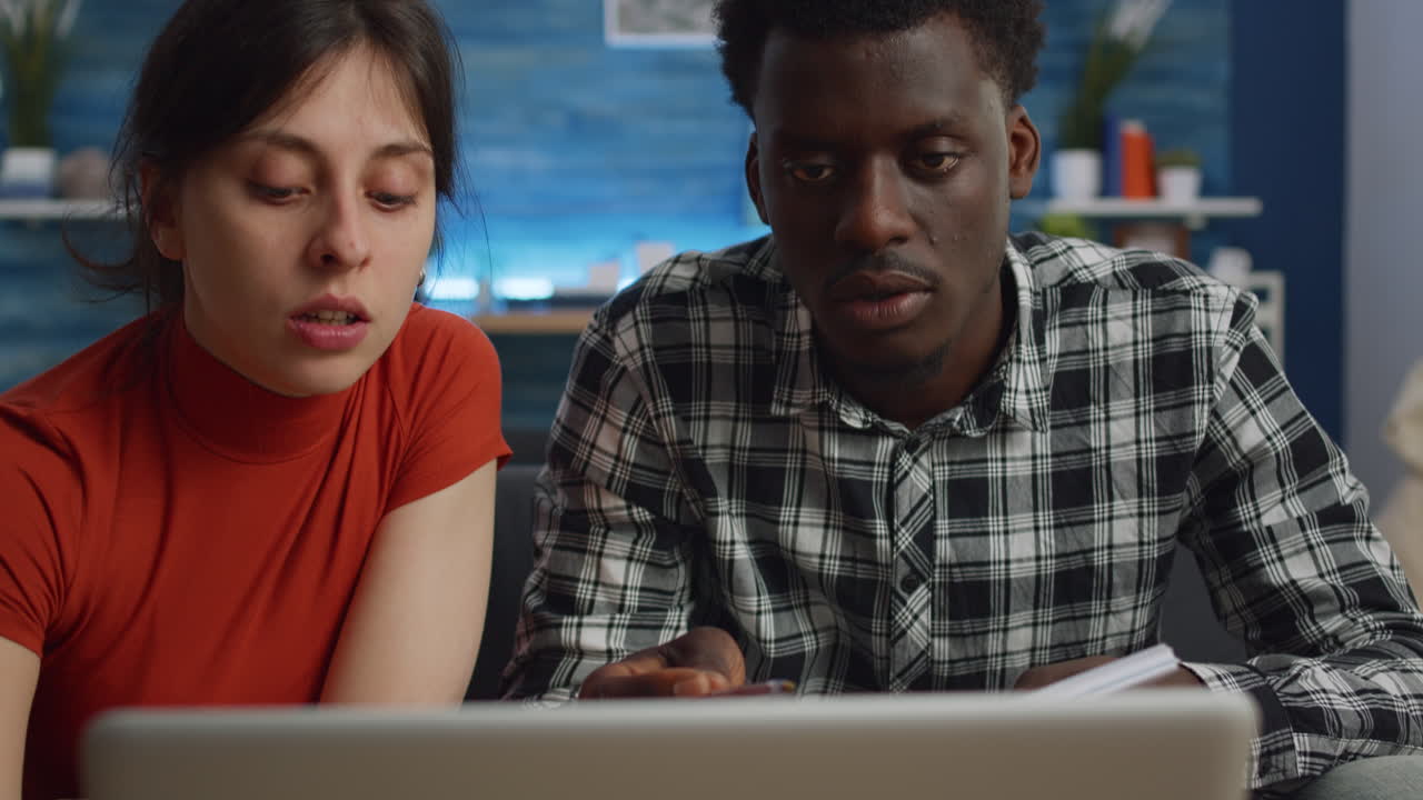 Interracial people paying taxes and bills checking budget