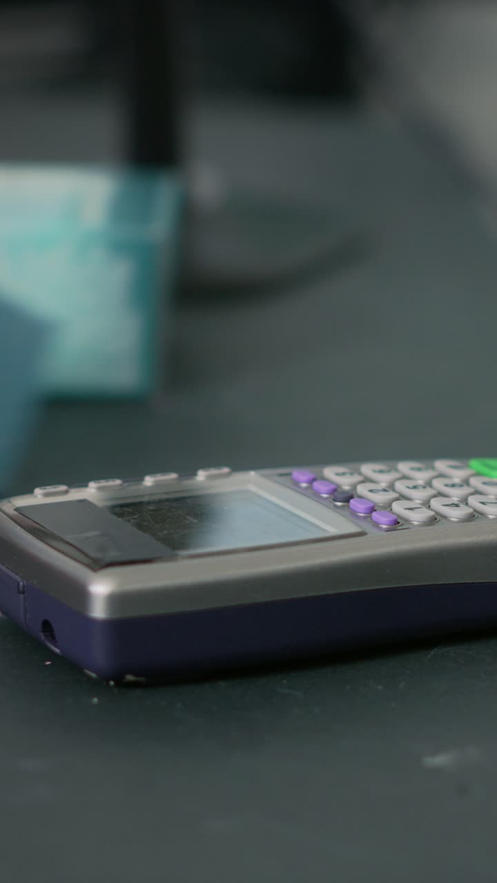 Vertical video: Customer buying pharmaceutical products with smartwatch