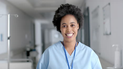 african american nurse smiles brightly in a hospital setting