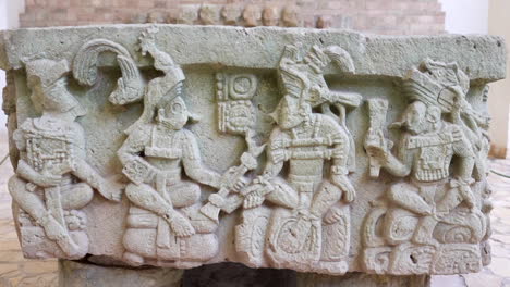 zoom in movement over a craved mayan stone at copan