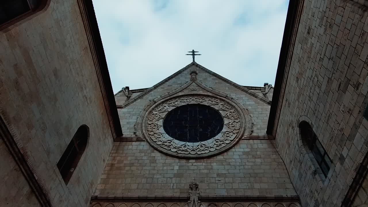 Symmetrical Facade of a Historic Church with a Rose Window in Jerusalem