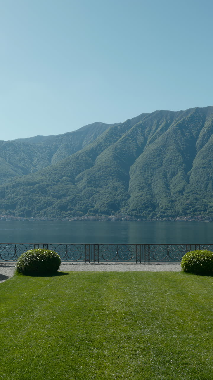 Picturesque Landscape with Lake, Mountains, and Lush Greenery