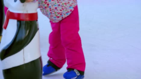 kids learning ice skating on artificial ice