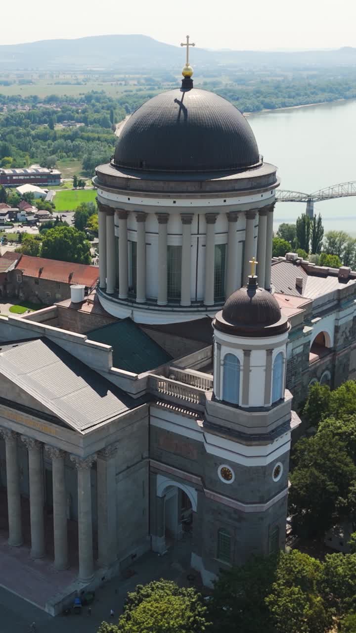 Close-up aerial of Esztergom Basilica in Hungary with the Danube River behind. Vertical Shot
