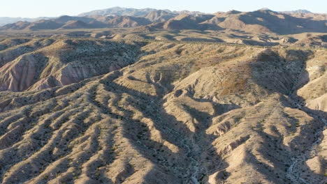 dry and barren badlands hilly landscape, aerial