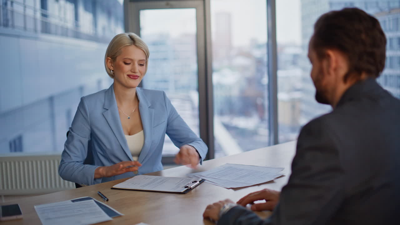 Startup founder finalizing agreement with investor greeting at workplace closeup