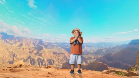 asian boy with a hat clapping hands after looking through the binoculars. boy researcher examines something while traveling at the top of mountain, travel tourism adventure concept, full body
