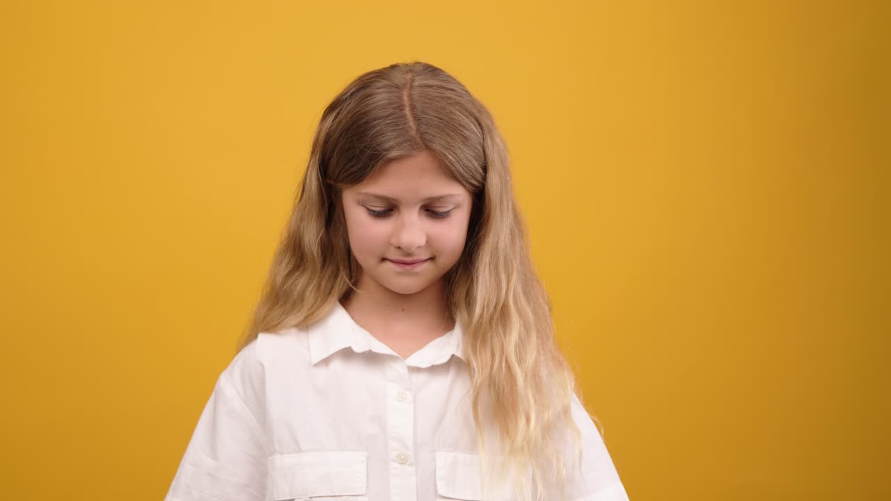 Portrait of a Smiling Blond Girl in White Shirt