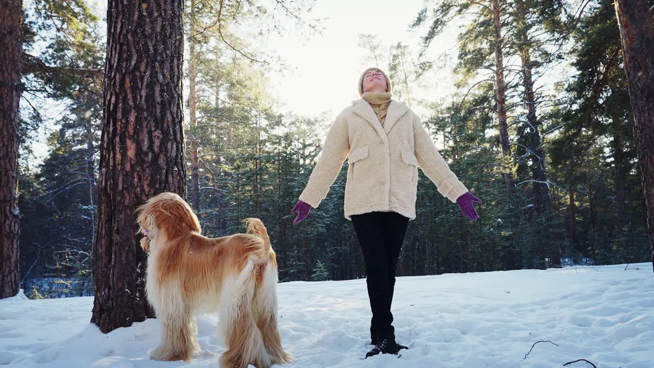 Woman and Dog in a Winter Forest