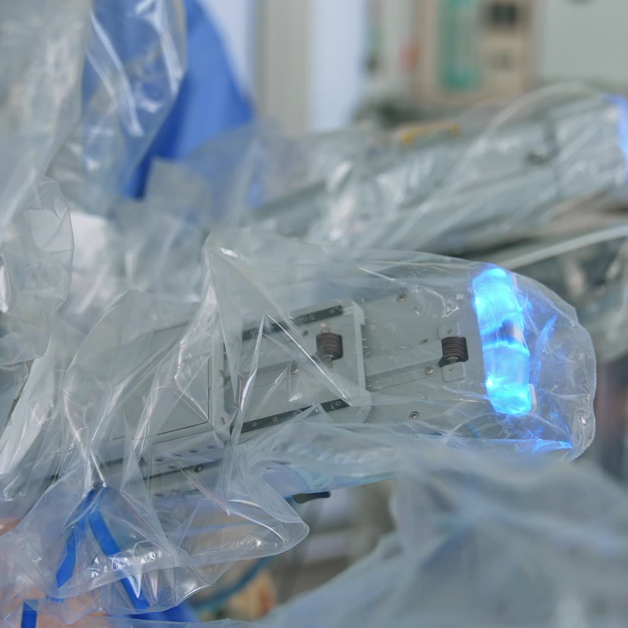 Laparoscopic operation conducted by the advanced equipment. Da Vinci robotic arms moving in the body of a patient