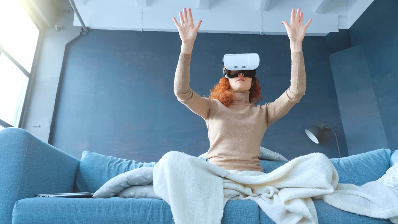 Woman Experiencing Virtual Reality on a Couch