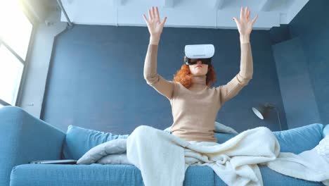 woman experiencing virtual reality on a couch