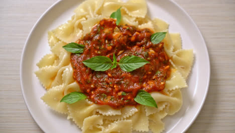 farfalle pasta with basil and garlic in tomato sauce - italian food style