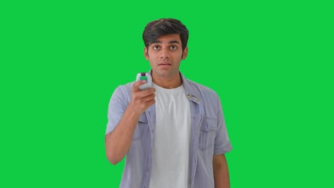 Indian-man-feeling-hot-and-switch-on-the-AC-Green-screen