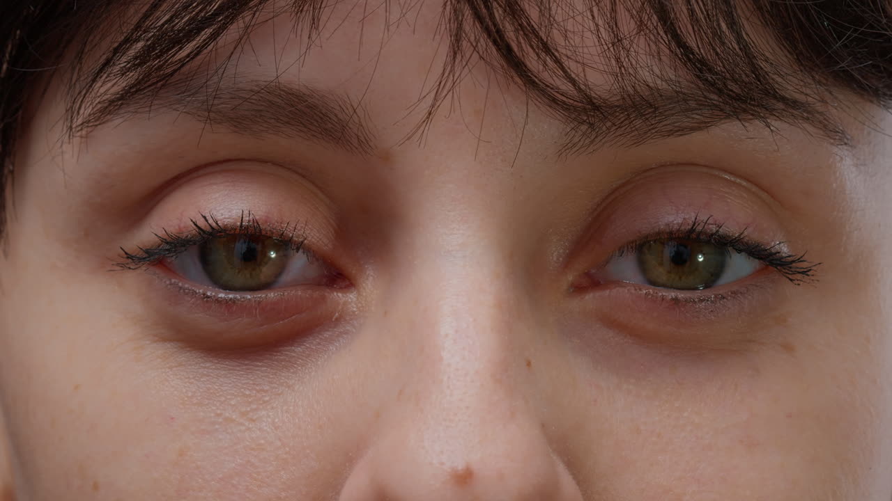 Macro shot authentic portrait of woman with natural skin