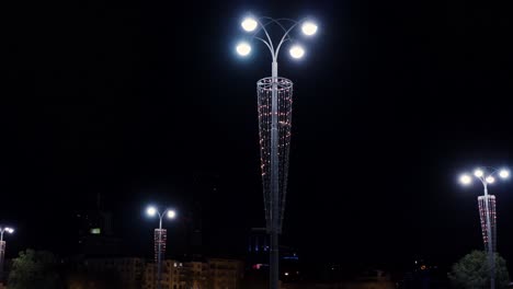 city street lights at night with decorations