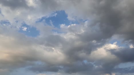 late-afternoon-thunderstorm-rain-clouds-forming-and-blending-across-the-african-horizon-time-lapse,-noise-free-4k-footage