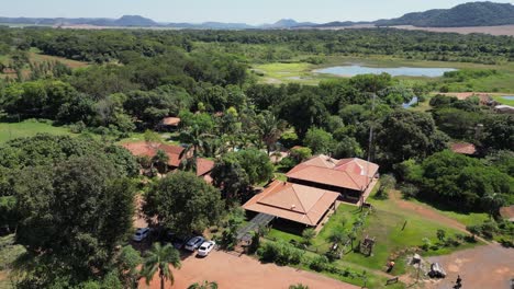 low flyover of lush green sucuri river bonito ecotourism resort, brazil