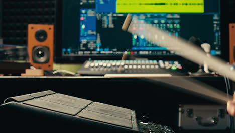 drummer plays an electronic drum kit in a music studio, recording music with sound engineer in rehearsal room. lesson of playing percussion drum instruments. rock music concert.