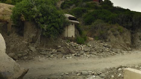 concrete pieces of bunkers laying down on coastline of albania remaining from communist dictatorship regime, past history of the east europe