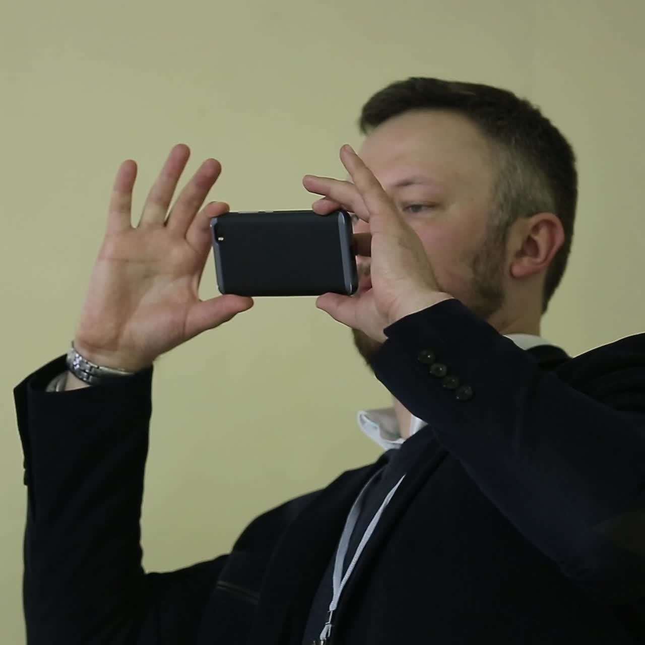 Man Taking Photo At Conference Room