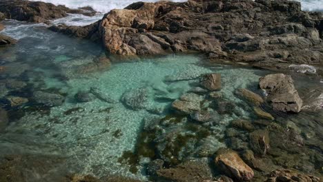 beautiful clear turquoise water rock pool at greenly beach, eyre peninsula, south australia