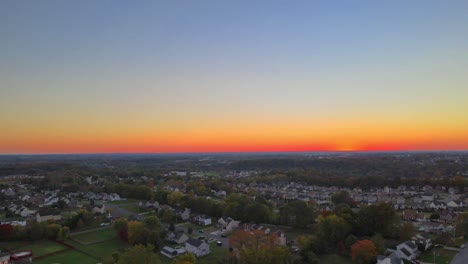 aerial view of suburban houses in sunset - drone shot