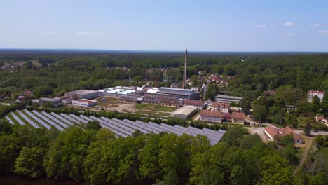 majestic aerial top view flight solar field plant factory at village chlum, czech republic summer 2023