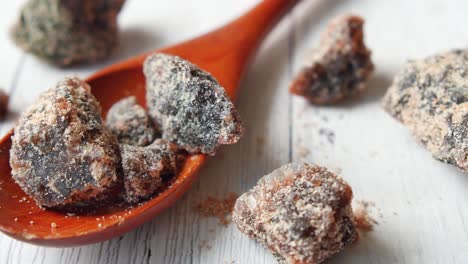 dried fruit pieces in wooden spoon