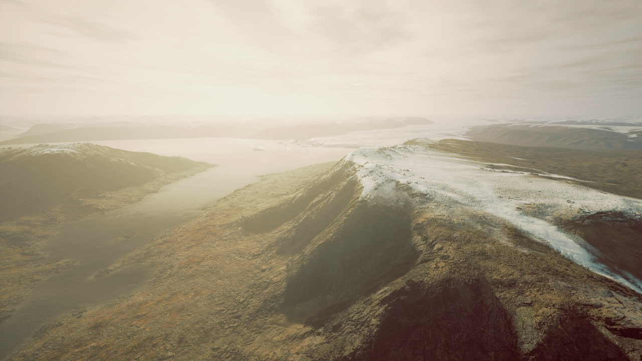 Stunning panoramic view of mountainous landscape during hazy afternoon light