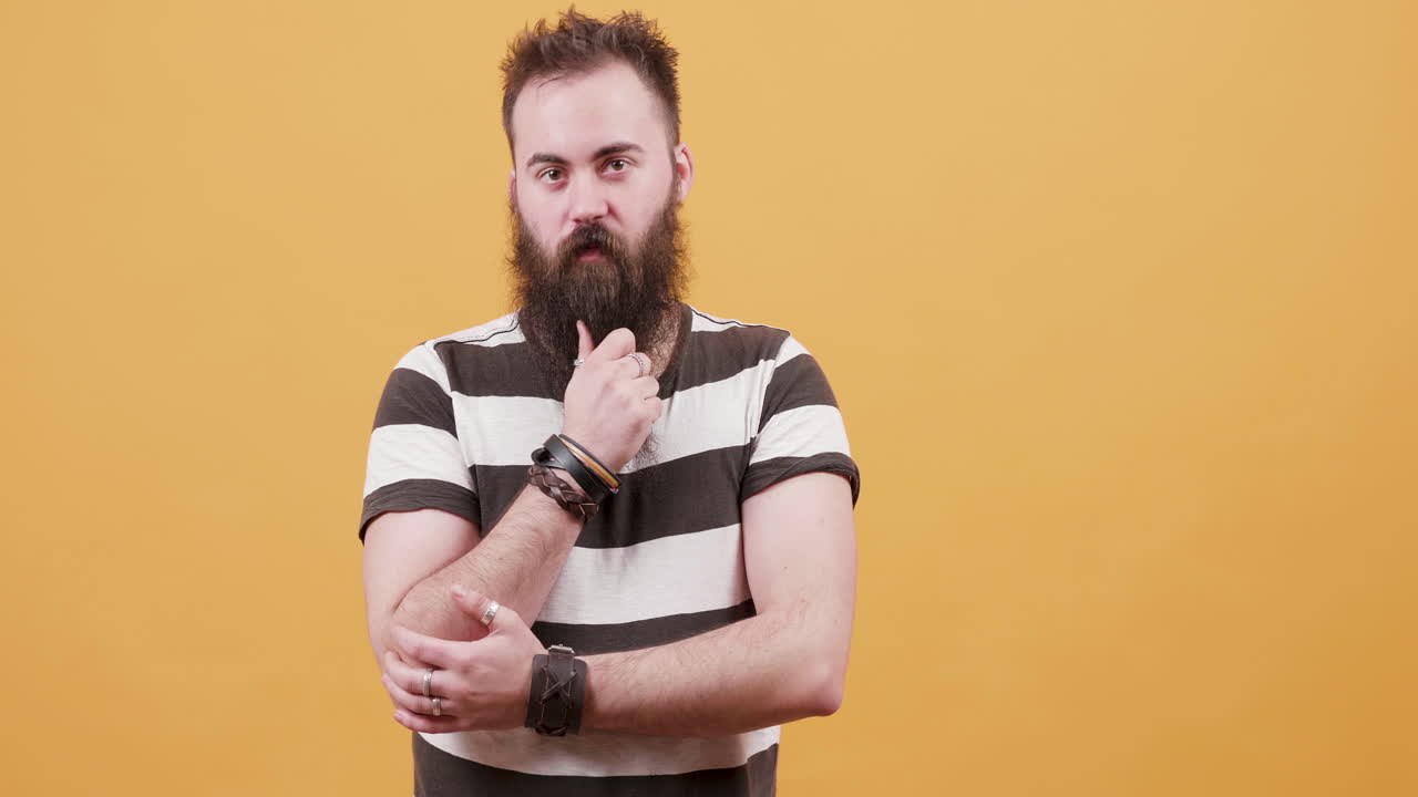 Man with beard on yellow background