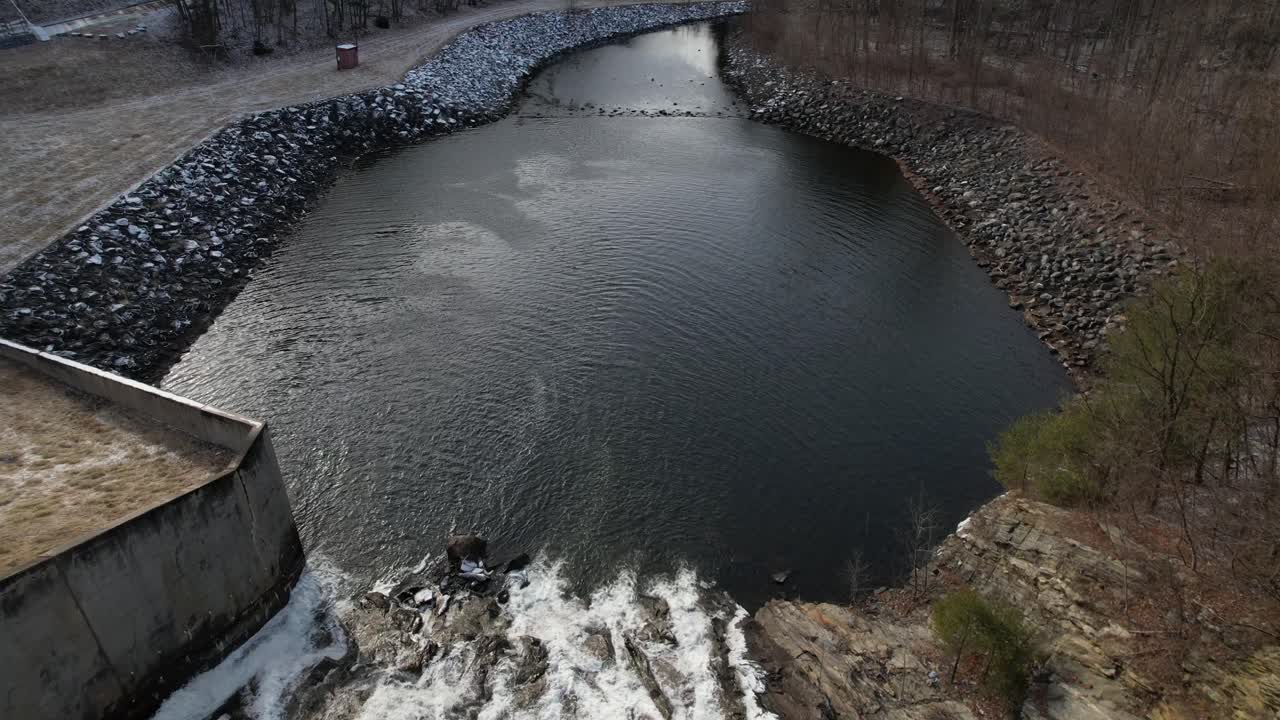 An aerial view over waterfalls on a cloudy day in upstate New York