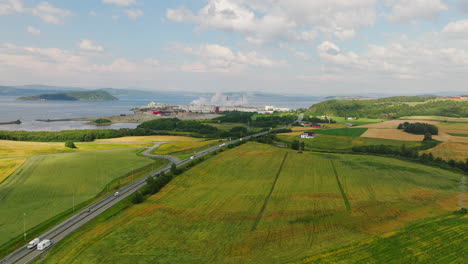 panoramic aerial view over cereal grain fields around highway e6 in norway