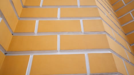 Yellow-Bricks-with-white-lining-on-church-bell-tower,-extreme-close-up-Kiev-Pecherske-Lavra,-Kyiv-Ukraine