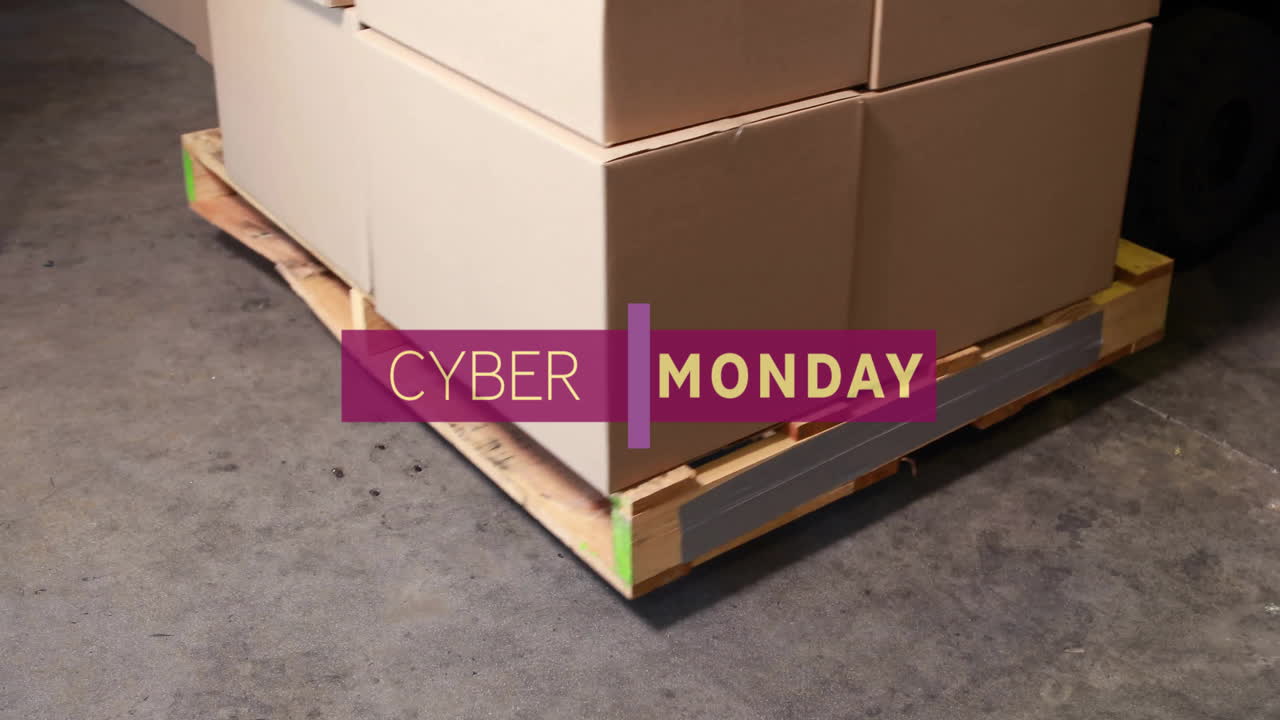 Animation of cyber monday text over boxes in warehouse