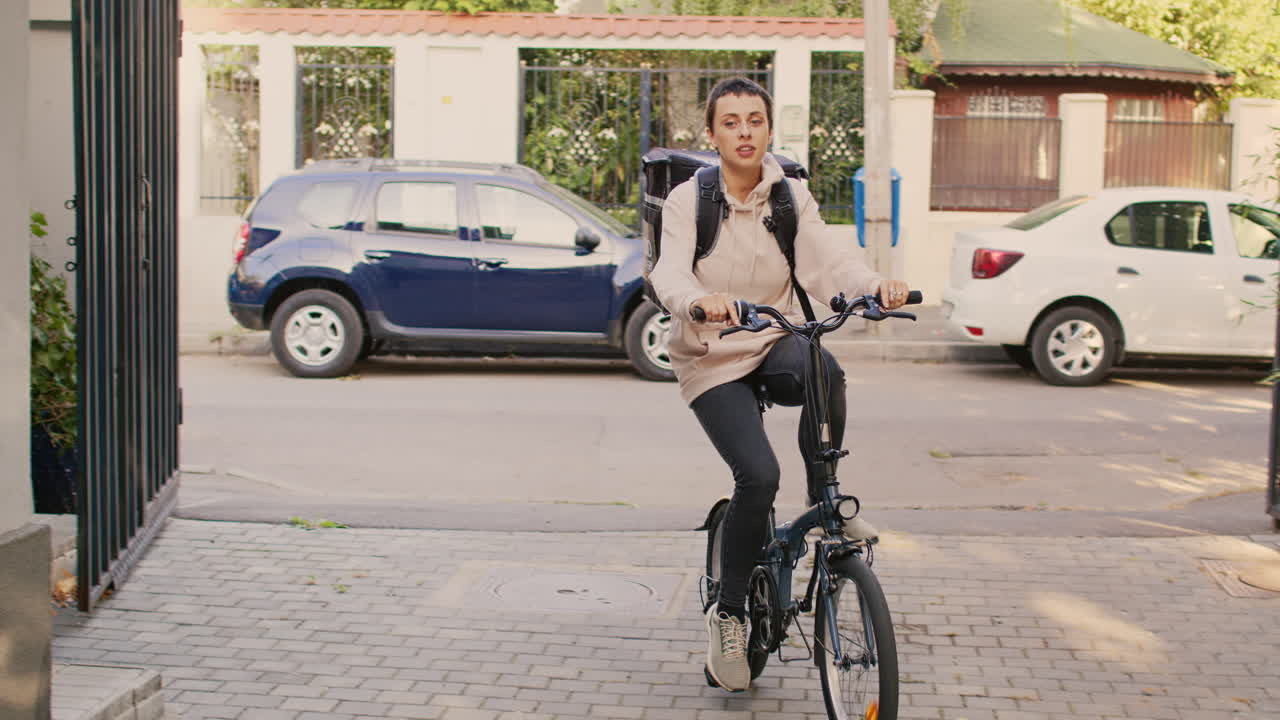 Woman on bicycle delivering food