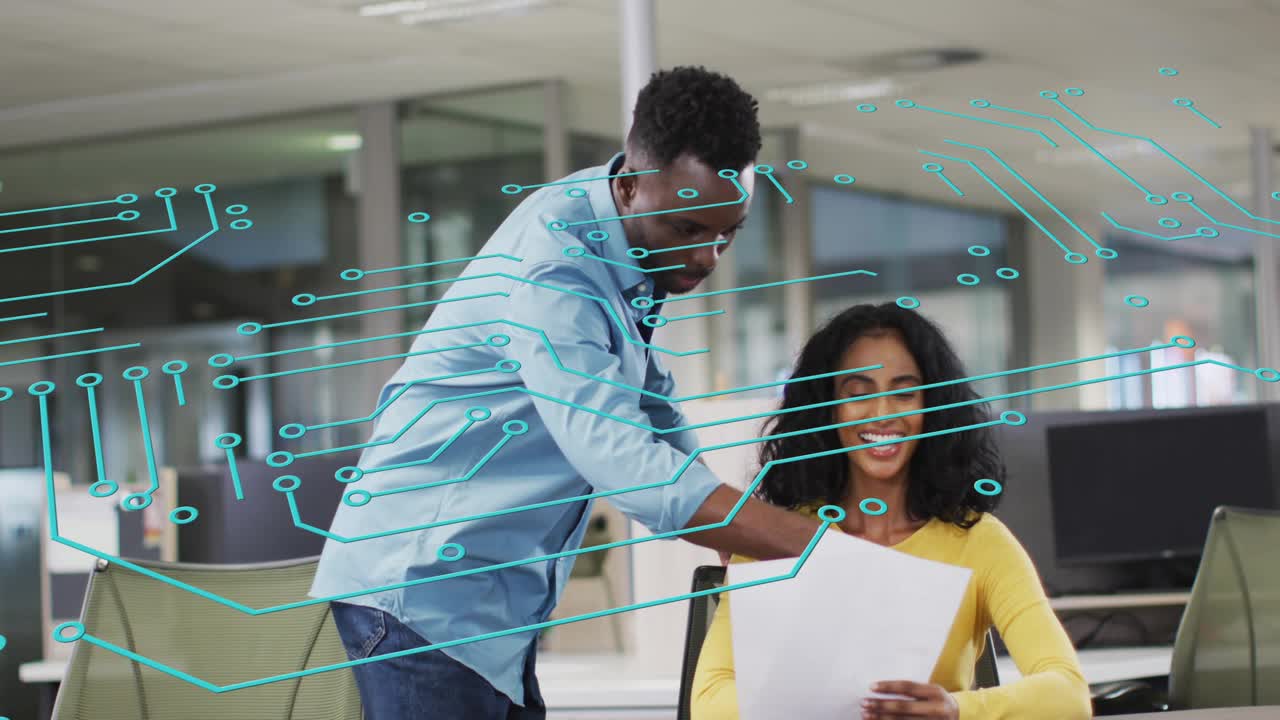 Man walking up to seated woman, reviewing business docs as cyan overlay fading over desk