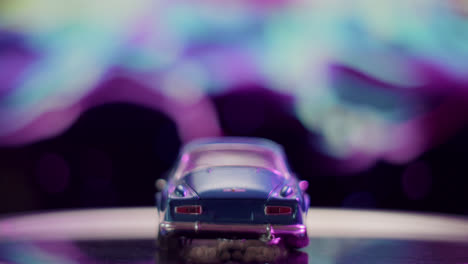 blue toy car with abstract bokeh background