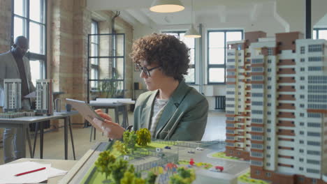 architects working on building models in an office