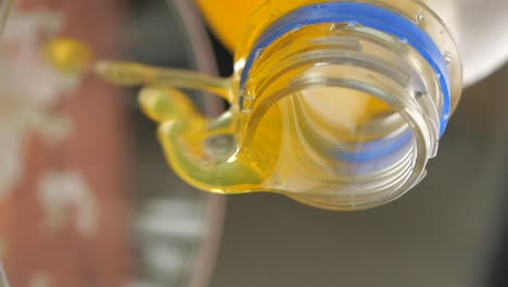 pouring orange juice from a bottle