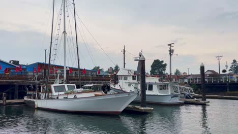 Boats-Docked-At-The-Harbor-In-Florence,-Oregon-At-Sunset