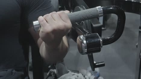 a man exhibiting his muscular physique while lifting heavy weights