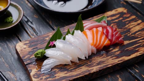 assorted sashimi platter on wooden cutting board