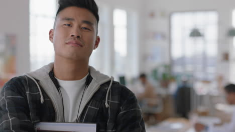 portrait young asian businessman smiling happy with arms crossed proud entrepreneur enjoying successful startup company in office workspace