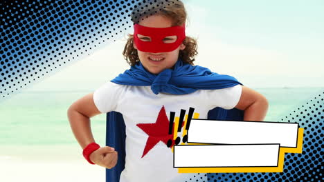 little boy wearing a superhero costume at the beach