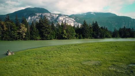 Scenic-Aerial-View-of-Squamish-Village-with-Mountain-Backdrop-and-Lake-in-British-Columbia