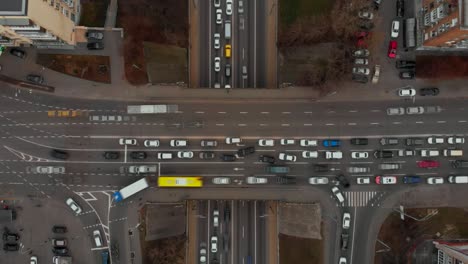 aerial timelapse of the cars passing by on a highway and a bridge