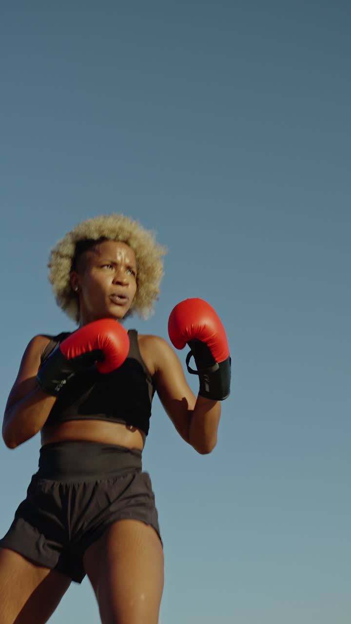 A woman boxing outdoors